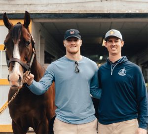 Kentucky QB Will Levis gets an NIL partnership with thoroughbred stallion, War of Will. Levis is pictured here with the horse and Claiborne Farm President Walker Hancock. | Photo courtesy of Athlete Advantage