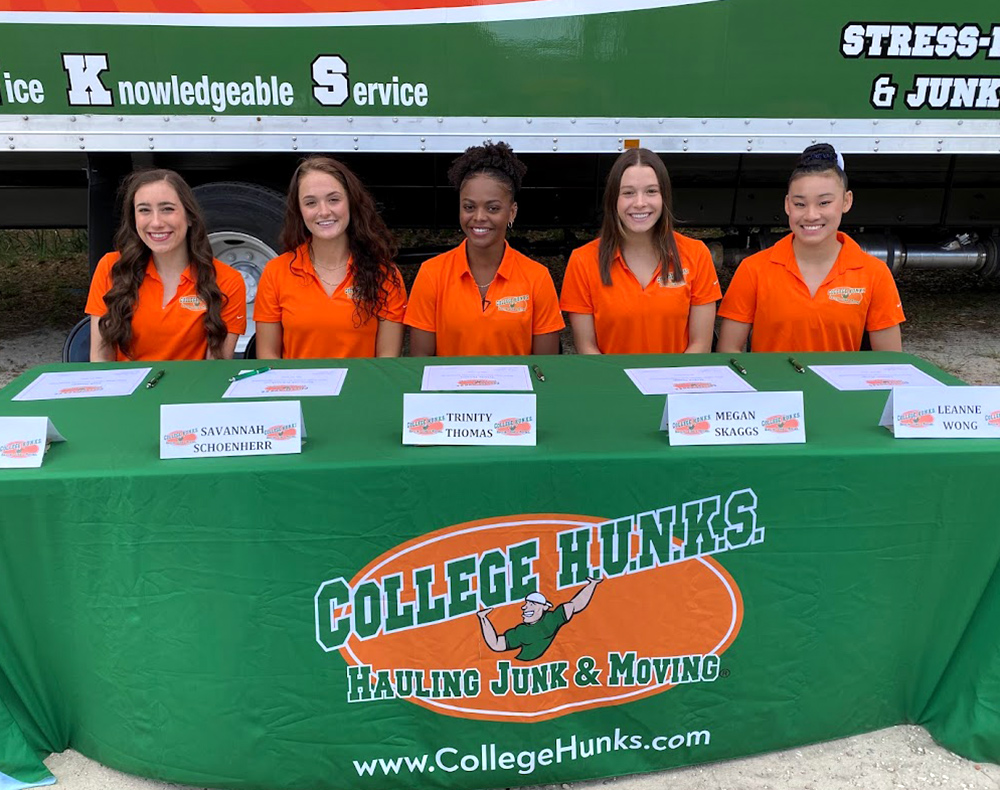 Florida gymnasts Leah Clapper, Savannah Schoenherr, Trinity Thomas, Megan Skaggs and Leanne Wong attend the NIL partnership signing event as their team enters an endorsement deal with College HUNKS Hauling Junk & Moving® | Photo courtesy of College HUNKS Hauling Junk & Moving®